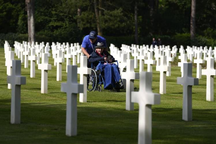 World War II and D-Day veteran Jake Larson visits the graves at the Normandy American Cemetery in Colleville-sur-Mer, Tuesday, June 4, 2024. World War II veterans from across the United States as well as Britain and Canada are in Normandy this week to mark 80 years since the D-Day landings that helped lead to Hitler’s defeat.