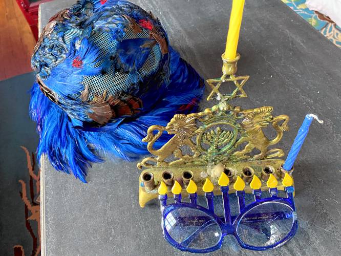 Tinky’s Hanukkah accessories and a menorah.