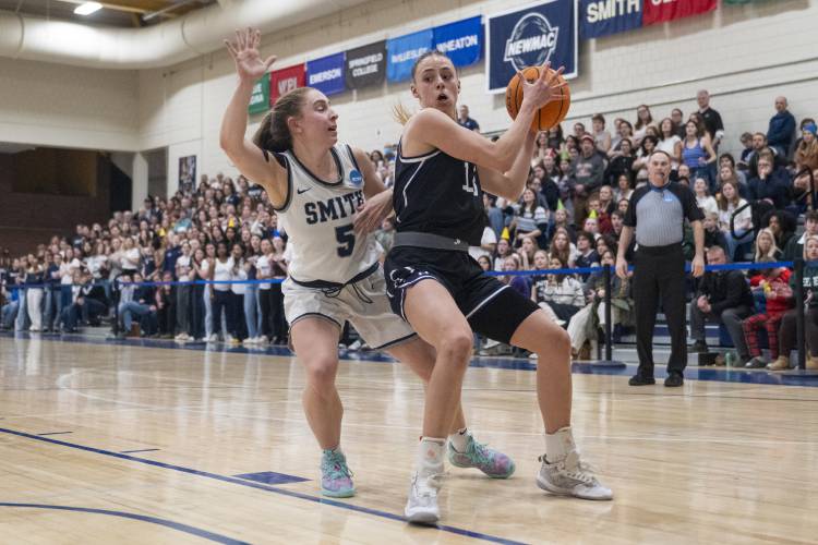 Amherst guard Laura Mendell, right, keeps the ball from Smith Guard Ally Landau (5) during the NCAA Division 3 Women's Basketball tournament Round of 32 game at Ainsworth Gym, Saturday, March 8, 2025, in Northampton.