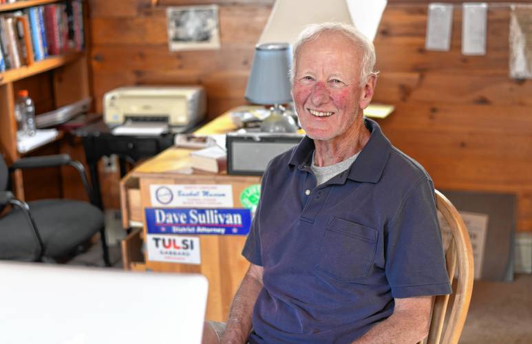 Chip Ainsworth sits at his desk in his Northfield home. 
