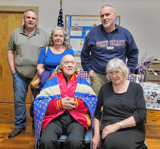 Military veteran Alfred O. “Ollie” Ohlson, seen here with loved ones, received a Quilt of Valor at a ceremony at the North Orange Grange on May 14.