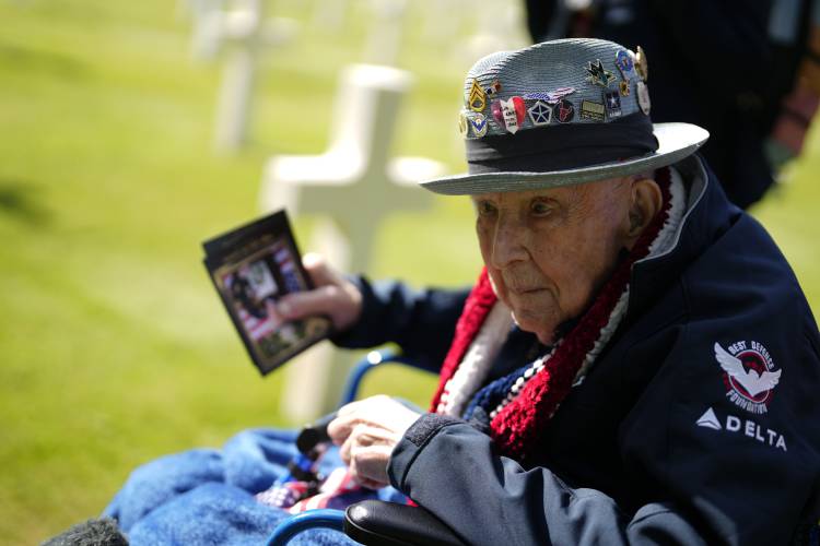 World War II and D-Day veteran Jake Larson visits graves at the Normandy American Cemetery in Colleville-sur-Mer, Tuesday, June 4, 2024. World War II veterans from across the United States as well as Britain and Canada are in Normandy this week to mark 80 years since the D-Day landings that helped lead to Hitler’s defeat.
