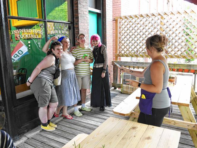 Patrons get their picture taken at the Dreamhouse restaurant on Third Street in Turners Falls.