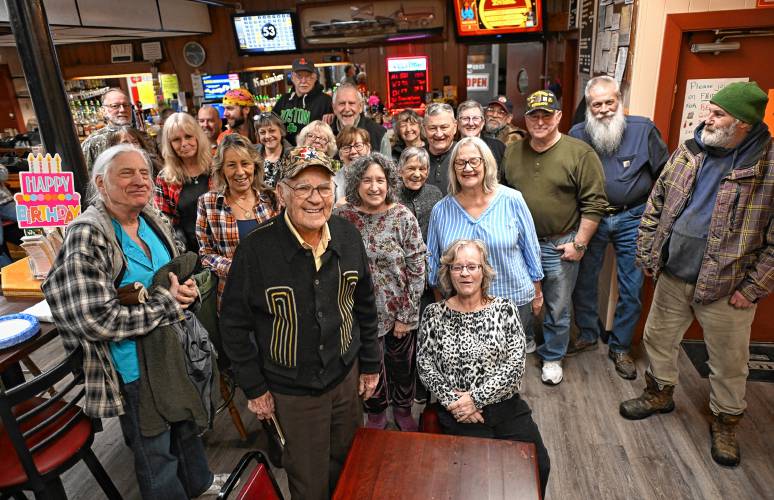 Lee Evers, center in black, at his birthday party at St. Kazimierz Society in Turners Falls on Thursday.