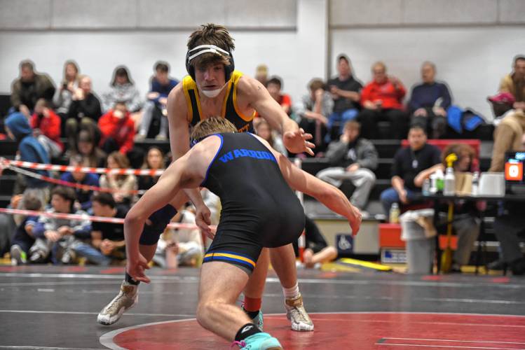 Mohawk Trail's Logan Moore goes for the takedown against Mount Everett's Ian Lanoue in the championship match at 157 during the MIAA Div. 3 West Championship at Mount Greylock High School Saturday. 