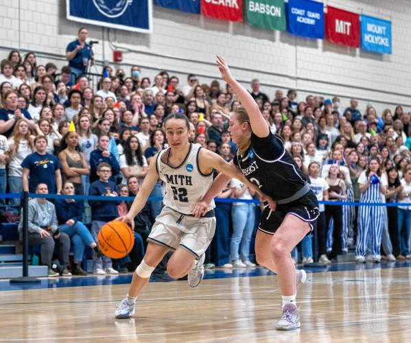 Smith guard Hannah Martin (22) dribbles around Amherst guard Reagan Pahl, right, during the NCAA Division 3 Women's Basketball tournament Round of 32 game at Ainsworth Gym, Saturday, March 8, 2025, in Northampton.