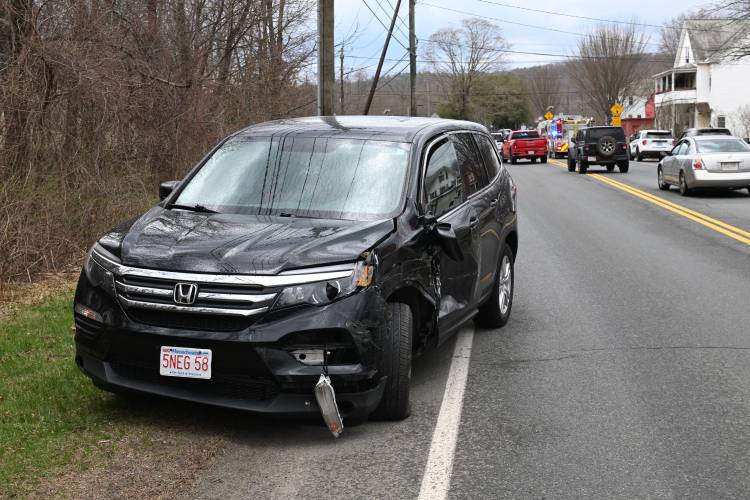 A Honda Pilot involved in a collision with a small school bus on Montague City Road and Depot Street in Montague City. 