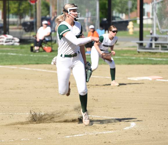 Greenfield’s MacKenzie Paulin finishes a pitch during the Green Wave’s 5-2 win over Agawam on Friday afternoon at Vets Field in Greenfield.