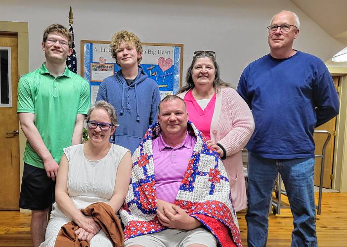 Military veteran Dereck G. Dowler, seen here with loved ones, received a Quilt of Valor at a ceremony at the North Orange Grange on May 14.