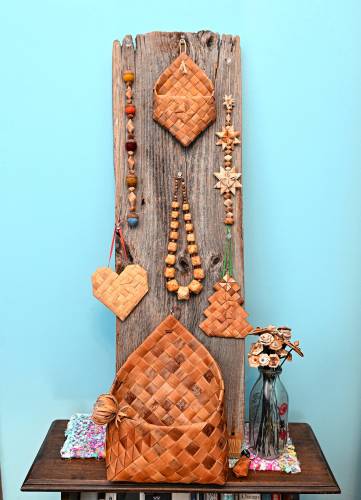 Elaine Moe’s birch bark products vary in style from traditional to contemporary and include baskets, necklaces, bottles (with wooden caps carved by her husband, Paul) and baby rattles. She officially formed Finnique – a portmanteau of Finnish and unique – in March.