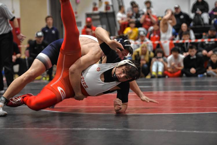 Franklin Tech's Collin Eddy gets the takedown against Mount Greylock's Jayquan Vazquez in the championship match at 190 during the MIAA Div. 3 West Championship at Mount Greylock High School Saturday. 