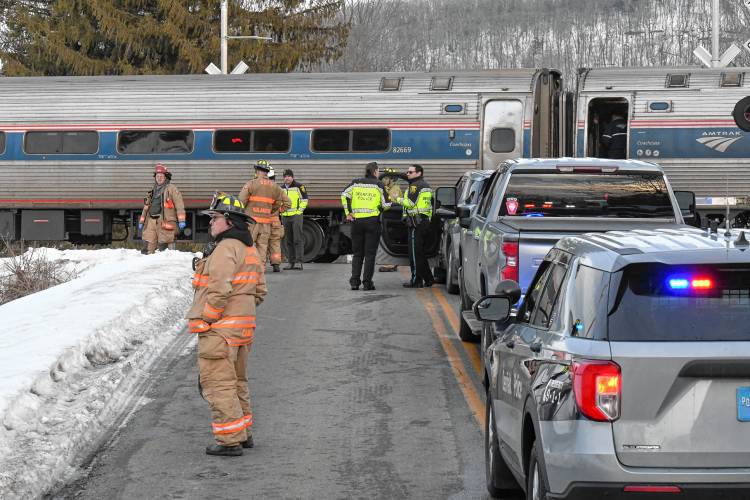 Deerfield police officers and South Deerfield fire personnel respond to the Pleasant Street railroad crossing where a 60-year-old man from South Deerfield was struck and killed by a northbound Amtrak train on Monday afternoon. 