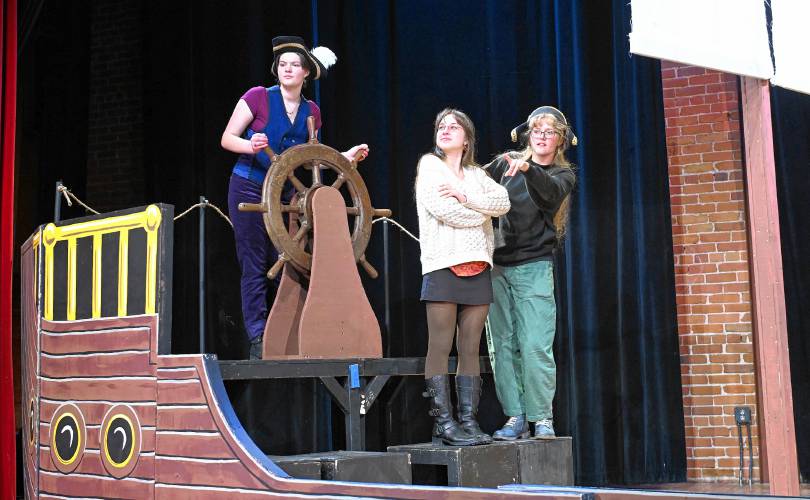 Soryn Squire as Captain Smolett, Ivy Newcombe as Dr. Livesley and Cedar Skinder as Squire Trelawney rehearse for Four Rivers Charter Public School’s production of “Treasure Island” at the Shea Theater Arts Center in Turners Falls. Performances will be held Friday, Feb. 28, and Saturday, March 1.