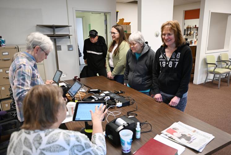 Citizens are checked in at Erving Town Hall for voting on Monday.