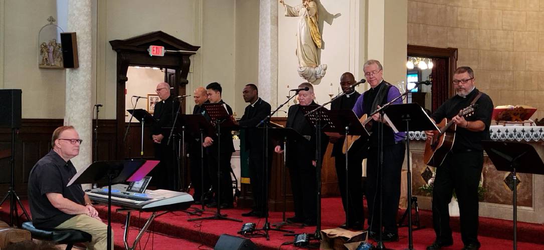The Singing Priests, a group of roughly 12 Catholic priests that serenades audiences with setlists that include sacred hymns and classic popular hits from the Beatles, Bob Dylan and others, have a summer concert scheduled for Our Lady of Peace at 7 p.m. on May 22.