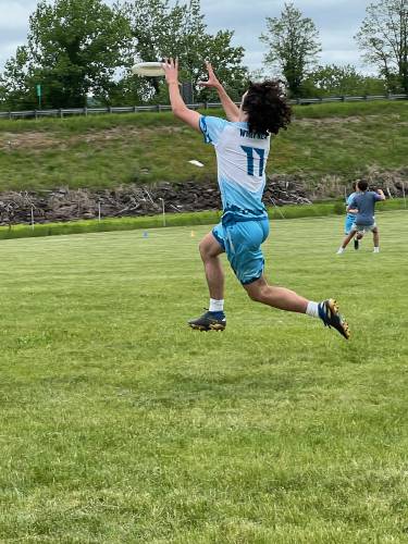 Four Rivers' Cooper Whitney rises up to make a catch during the Pioneer Valley Invitational Tournament in Northampton over the weekend. 