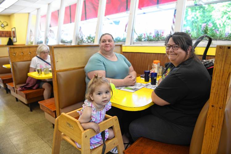 Jessica Brooks of Montague sits with Jazlyn Weld, 2, and her mother Jenna Weld, right, of Turners Falls at the Shady Glen Diner on Avenue A in Turners Falls.