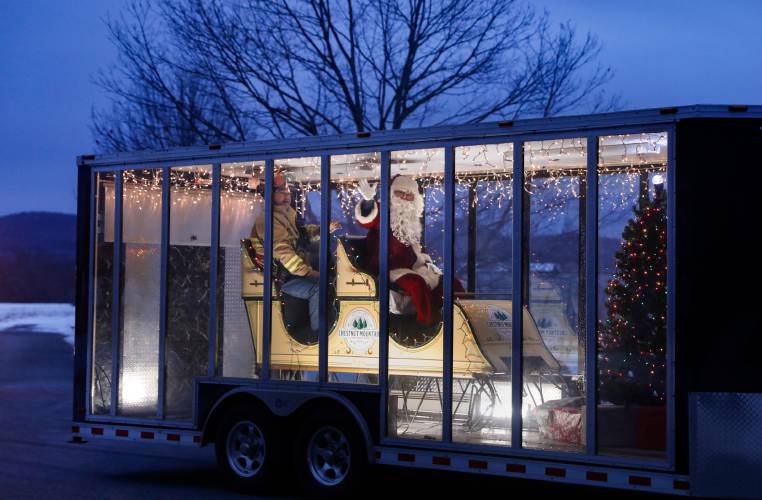 Santa Claus is paraded through the streets of Whately as part of the Whately Police and Firefighters associations’ Holiday Parade in 2019. The sixth annual parade will be held Saturday.