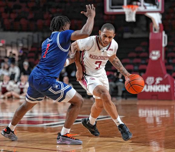 UMass senior guard Rahsool Diggins (7) drives against Richmond’s Mikkel Tyne in a game earlier this season at Mullins Center in Amherst. UMass senior guard Rahsool Diggins (7) drives against Richmond’s Mikkel Tyne in a game earlier this season at Mullins Center in Amherst.