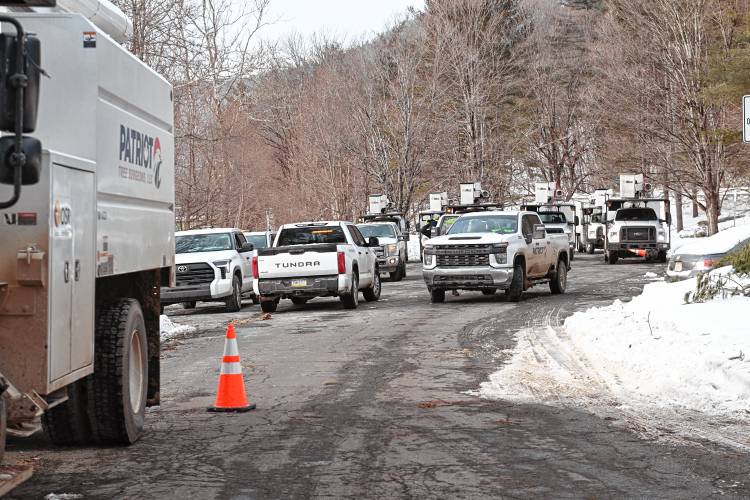 Utility trucks stage at the Shunpike Rest Area in Charlemont to deal with continued power outages in western Franklin County.