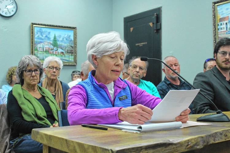 Joanne Woodcock, a trustee of the Orange Public Libraries, speaks to the Orange Selectboard at the May 16 meeting in front of a packed meeting room inside Town Hall.