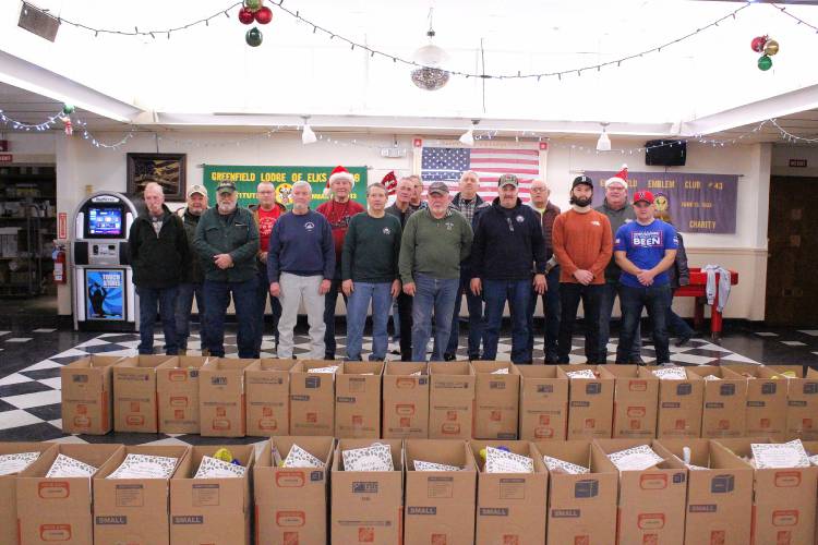 Greenfield Elks Lodge members assembled and delivered 50 Christmas meal boxes to residents in need on Saturday morning.