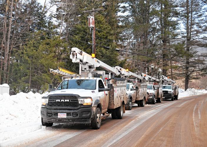 Utility trucks stage in Rowe to deal with continued power outages in western Franklin County. 