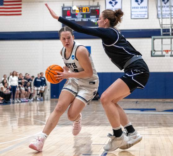 Smith forward Ella Sylvester, left, attempts to pass Amherst forward Maya Cwalina, right, during the NCAA Division 3 Women's Basketball tournament Round of 32 game at Ainsworth Gym, Saturday, March 8, 2025, in Northampton.