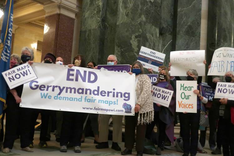 Opponents of Republican redistricting plans demonstrate at the Wisconsin state Capitol in Madison in October 2021.