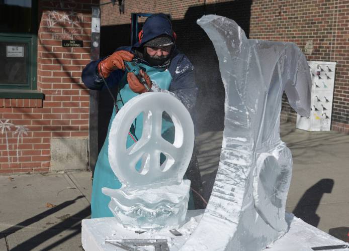 Murray Long of Essex, Vermont, carves his ice sculpture on Main Street in Greenfield for the 2023 Winter Carnival. The 102nd annual event returns Friday through Sunday.
