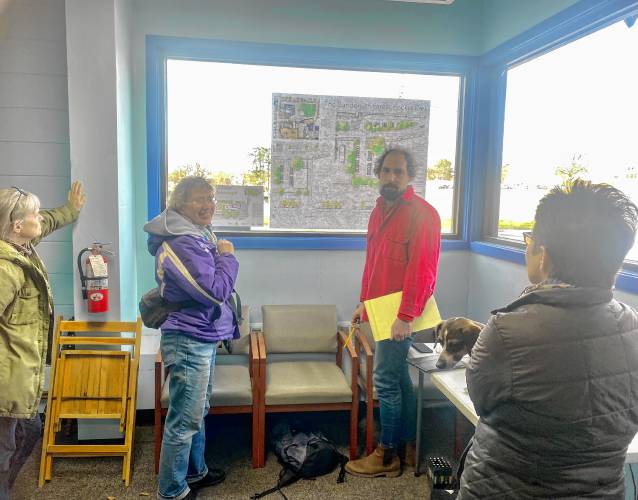 Local landscape engineer Peter Wackernagel discusses plans to create a pocket park at 20 Sanderson St. with Greenfield residents. Local landscape engineer Peter Wackernagel discusses plans to create a pocket park at 20 Sanderson St. with Greenfield residents.