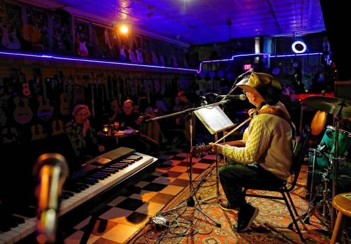 Louis Lamothe of West Springfield sings an orginal song during a Wenesday open mic night at Luthier's Co-op in Easthampton.