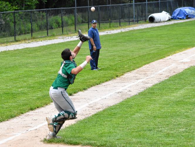 Greenfield catcher Luca Siano catches an infield fly against Boston English during the Green Wave’s 2-0 loss in the MIAA Division 5 semifinal round on Tuesday at Assumption University in Worcester.