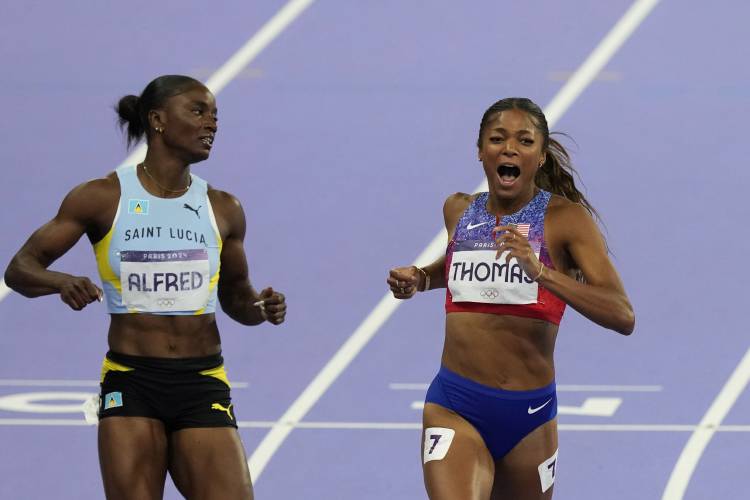 Florence’s Gabby Thomas crosses the finish line ahead of silver medalist Julien Alfred, of Saint Lucia, to win the gold medal in the women's 200 meters final at the 2024 Summer Olympics, Tuesday, Aug. 6, 2024, in Saint-Denis, France.