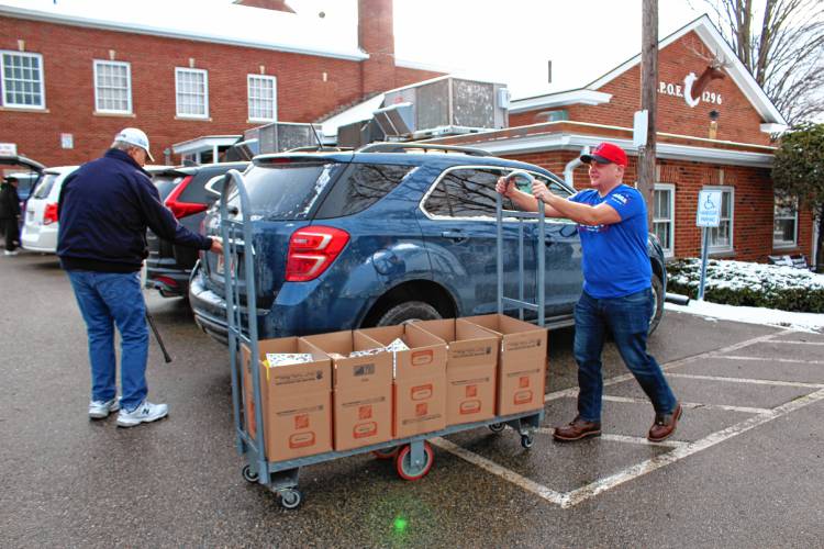 Greenfield Elks Lodge members assembled and delivered 50 Christmas meal boxes to residents in need on Saturday morning.