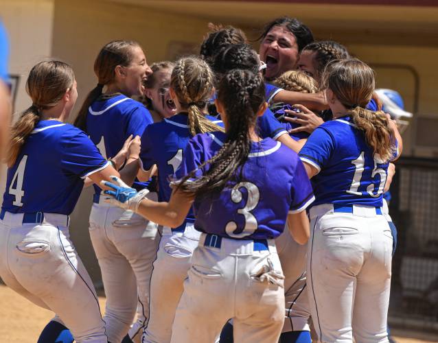 The Turners Falls softball team celebrates after recording the final out of their 5-0 win over Georgetown in the MIAA Division 5 championship game on Saturday at Sortino Field on the ca