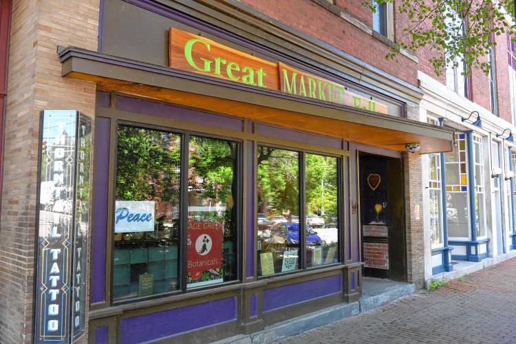 A peace sign in the window at Great Falls Market in Turners Falls. 