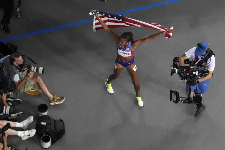 Florence’s Gabby Thomas celebrates after winning the women's 200-meter final at the 2024 Summer Olympics, Tuesday, Aug. 6, 2024, in Saint-Denis, France.