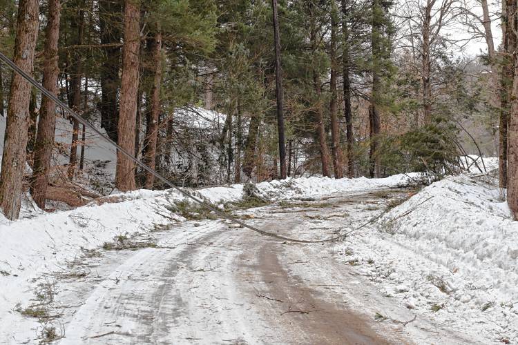 Downed utility lines block Middle Road in Hawley on Monday. 