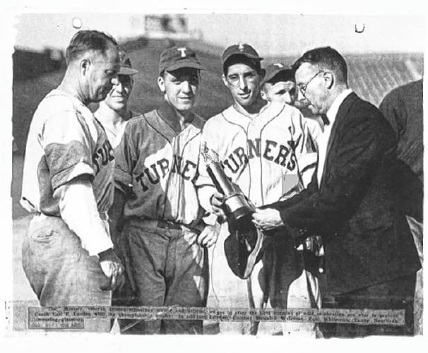 From the scrapbook of Turners Falls baseball coach, Earl Lorden, during the 1942 baseball season: Members of the Turners Falls baseball team in 1942 celebrating their big victory over Arlington.