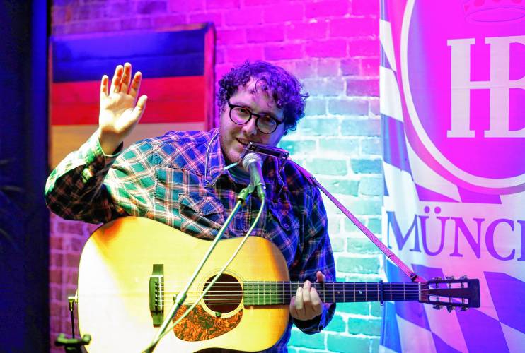 Matt Emmer thanks the crowd after performing at an open mic at Wurst Haus in Northampton. The Leeds singer-songwriter sometimes sometimes plays three regional open mics a week.