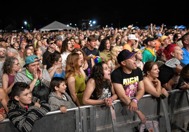 Fans cheer for Cake as they play the Main Stage Friday night at the Green River Festival at the Franklin County Fairgrounds.