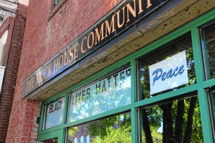 A peace sign in the window at The Brick House Community Resource Center in Turners Falls. 