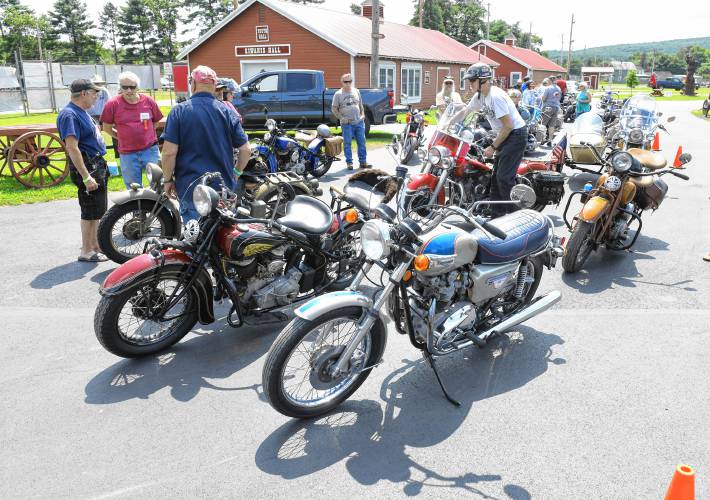 Antique motorcycles line up on Friday during an event at the Franklin County Fairgrounds in Greenfield celebrating the 70th year of the Antique Motorcycle Club of America.