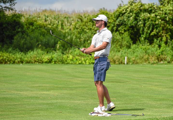 Dedham’s Joey Lenane watches his approach shot in the 15th hole at Ledges Golf Club in South Hadley during the 43rd Massachusetts Amateur Public Links Golf Championship on Wednesday. Lenane posted a two-round total of 13-under 131 to capture the title by a whopping 11 strokes.