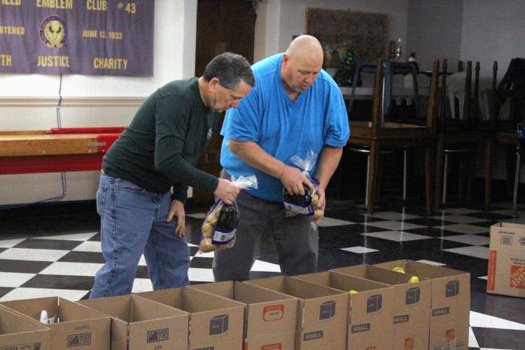 Greenfield Elks Lodge members assembled and delivered 50 Christmas meal boxes to residents in need on Saturday morning.