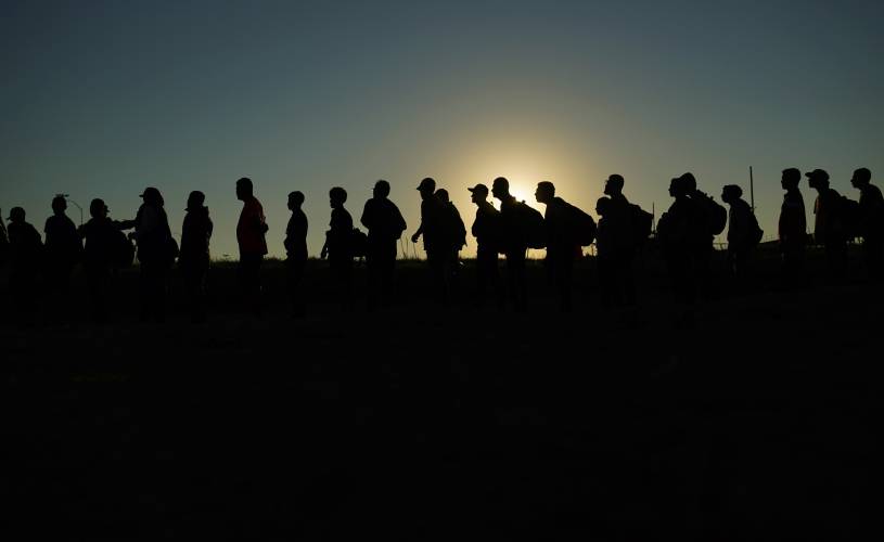 Migrants who crossed the Rio Grande and entered the U.S. from Mexico are lined up for processing by U.S. Customs and Border Protection, Sept. 23, 2023, in Eagle Pass, Texas. Migrants who crossed the Rio Grande and entered the U.S. from Mexico are lined up for processing by U.S. Customs and Border Protection, Sept. 23, 2023, in Eagle Pass, Texas.
