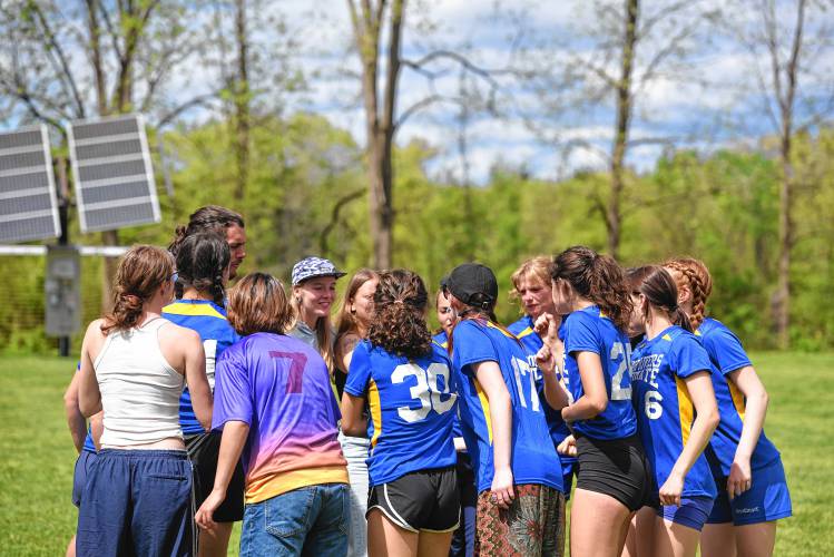 The Four Rivers girls ultimate team huddles during its game against Cumberland during the Four Rivers Ultimate Tournament in Greenfield Saturday.