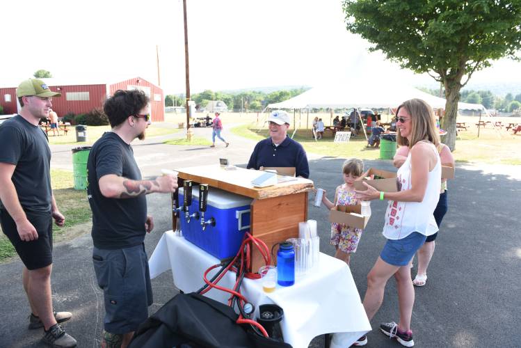 Hitchcock Brewing Co. pours beers at the Big Brothers Big Sisters Point 5K fundraiser at the Franklin County Fairgrounds in 2022. The event, which is rodeo-themed this year, returns on Thursday, July 18.