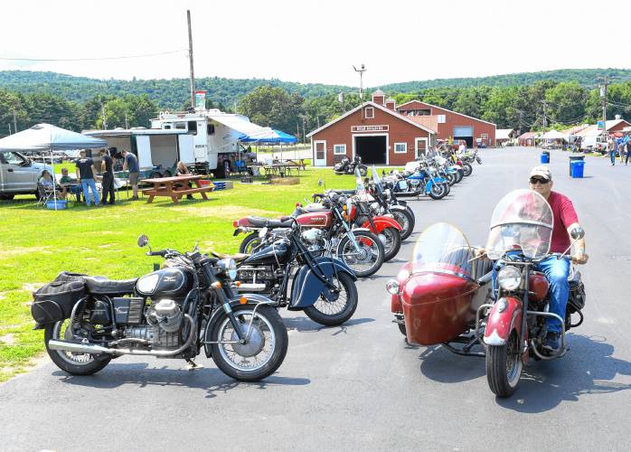 Antique motorcycles line up on Friday during an event at the Franklin County Fairgrounds in Greenfield celebrating the 70th year of the Antique Motorcycle Club of America.